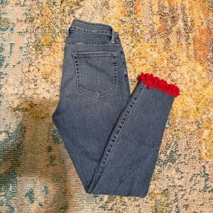 Good American Blue Jeans with Red Pom Trim
